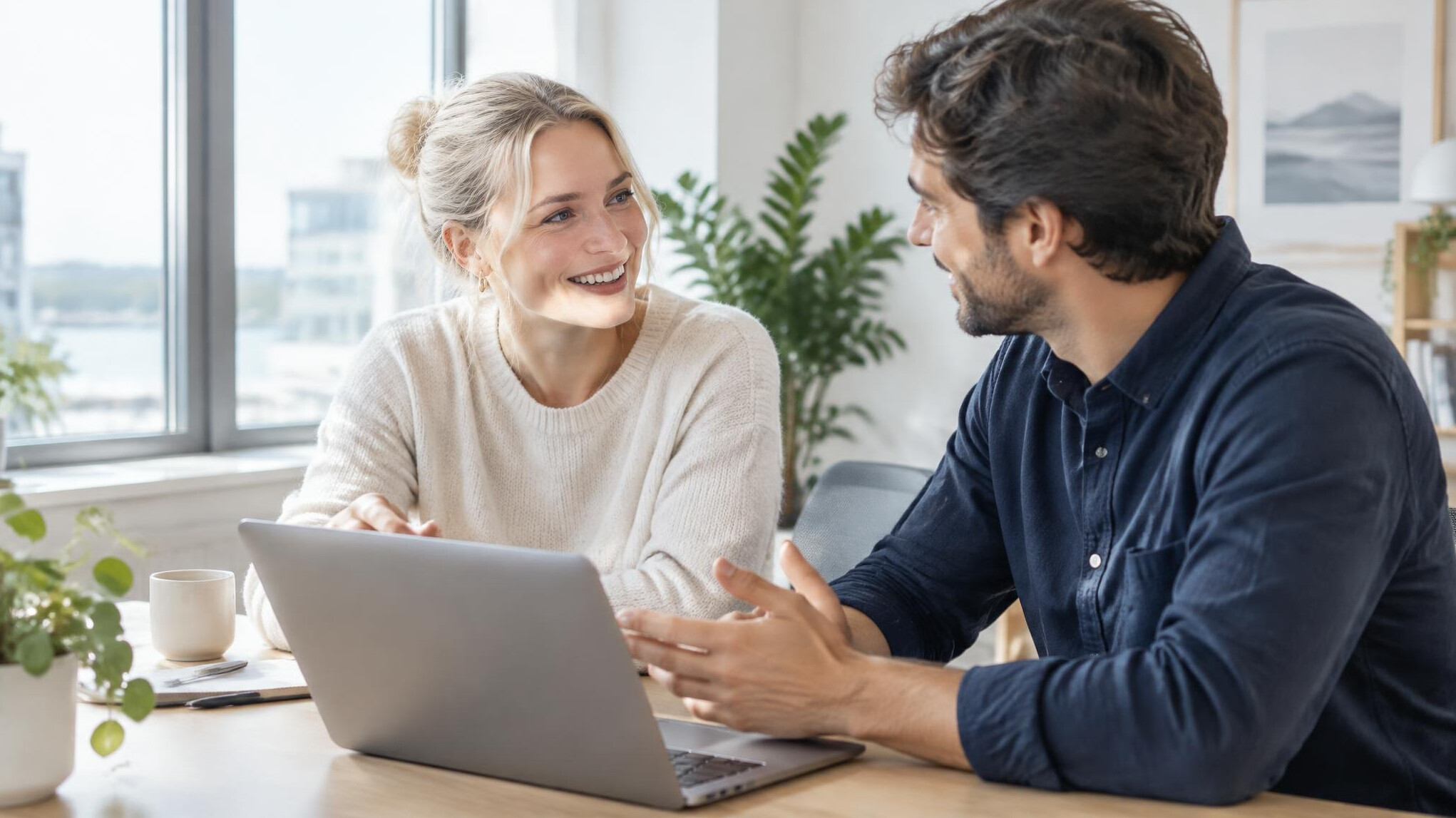 Office team talking in a bright office